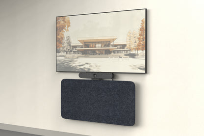 Heckler Credenza Neo wall-mounted in charcoal acoustic felt below a conference room display and video bar — angled view of the AV credenza in a modern office.