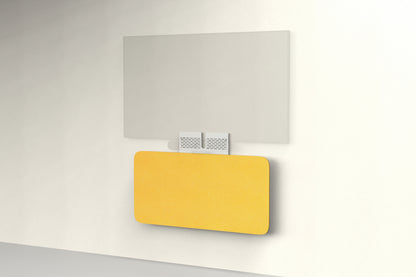 Heckler Credenza Neo in Citrine — wall-mounted AV credenza with citrine yellow acoustic felt panel concealing components below a display.