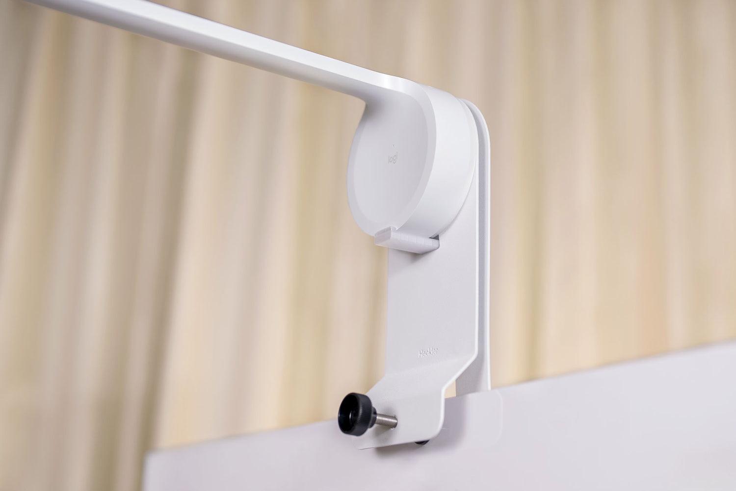 Heckler Whiteboard Mount — locking tab securing Logitech Scribe base