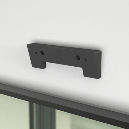 Heckler Angle Adapter for Huddly C1 — wedge-shaped adapter front view, Black