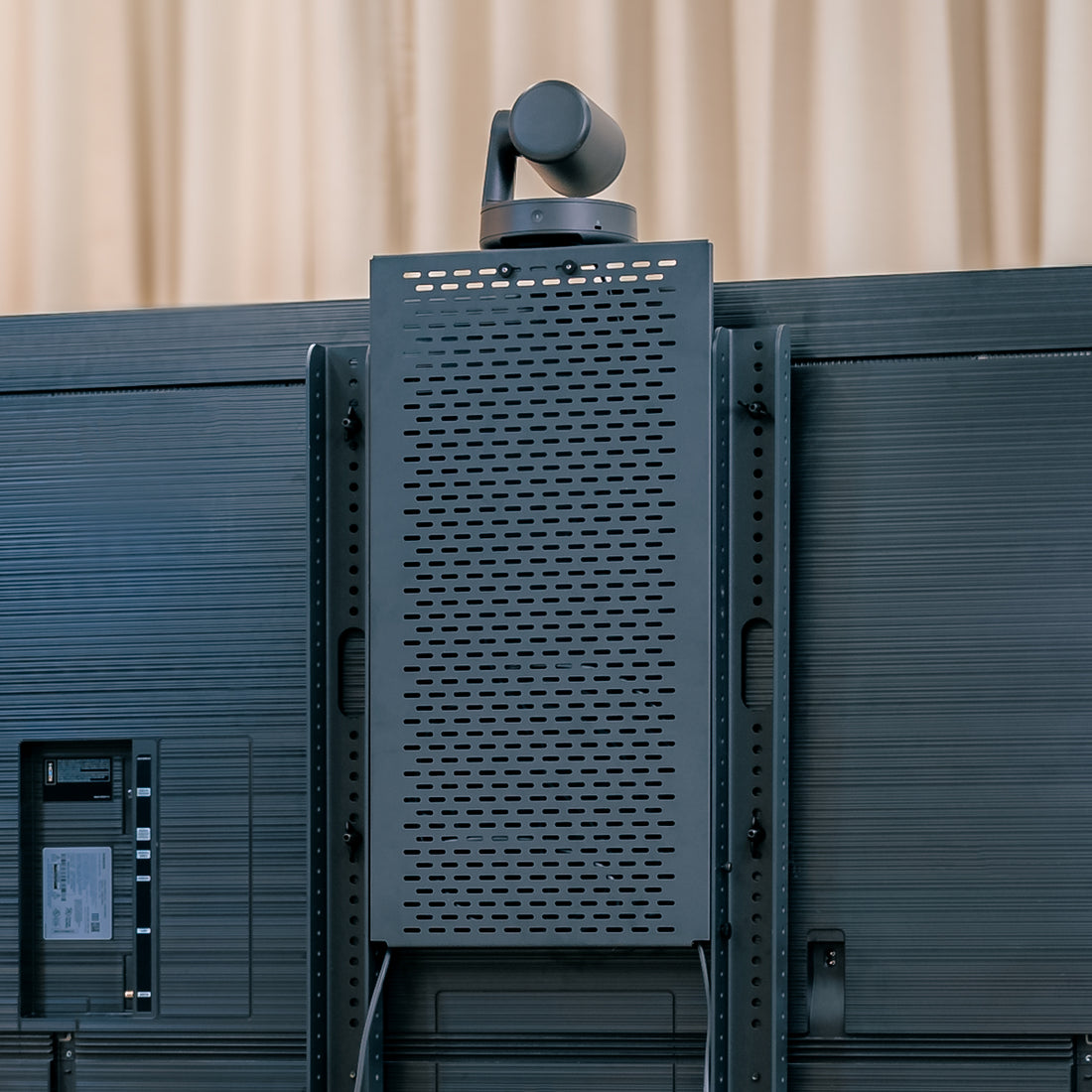 Device Panel XL installed on Heckler AV Cart — rear view showing pill-shaped cutouts and mounted components