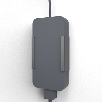 Power Adapter Mount installed under table in huddle room — concealed power supply configuration