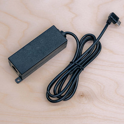 PoE to USB-C adapter T519, angle view showing compact form factor and LED indicators